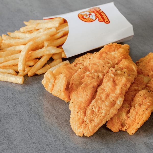 Crispy fried chicken tenders and golden french fries in a Southern Style Chicken & Waffle branded container.
